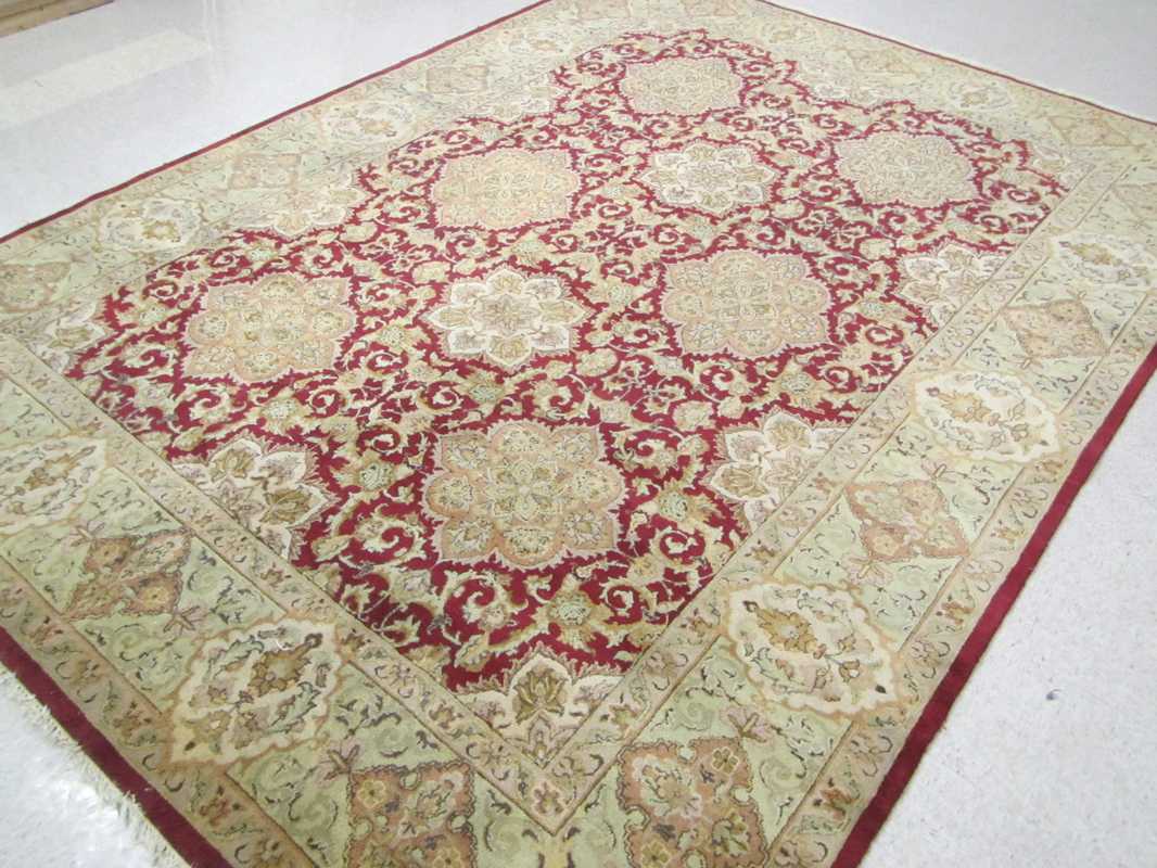 Appraisal: HAND KNOTTED ORIENTAL CARPET Indo-Persian eight medallion and stylized floral