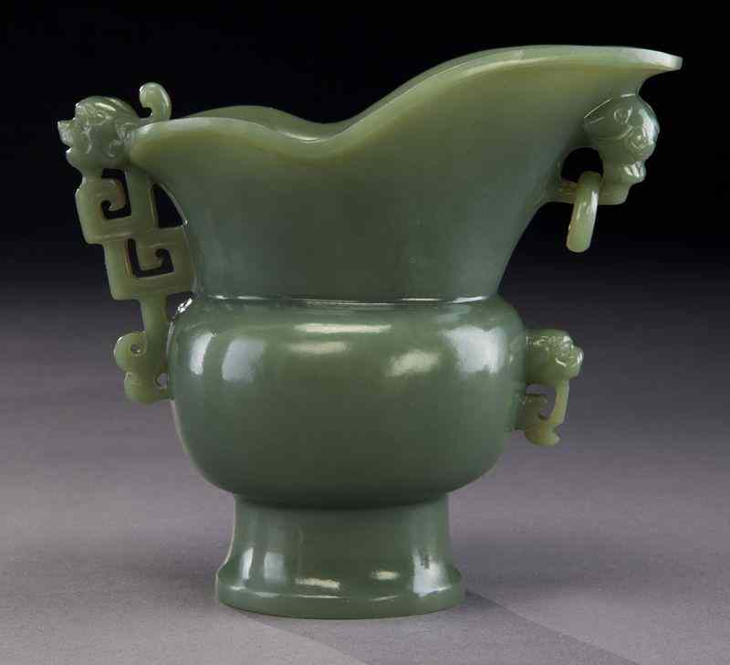 Appraisal: Chinese carved celadon jade Jue cup with three carved handles