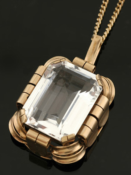 Appraisal: An Art Deco quartz pendant The rectangular cut quartz weighing