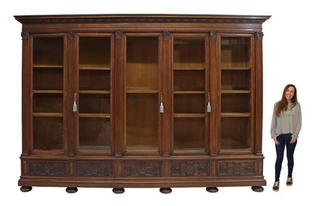 Appraisal: Monumental French walnut bookcase late th c molded cornice five