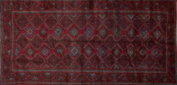 Appraisal: NORTHWEST PERSIAN Area rug with all-over geometric medallions on a