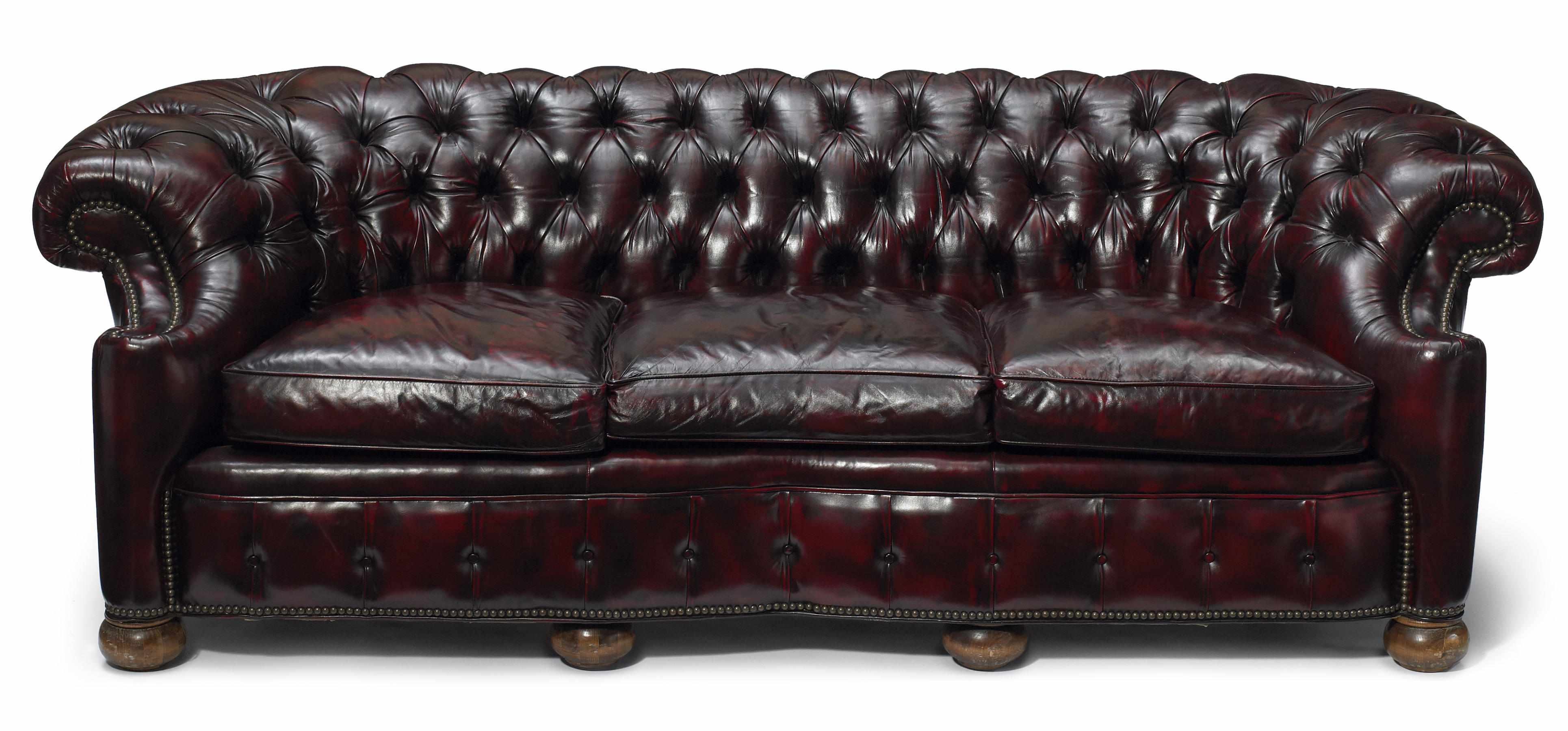 Appraisal: A nailhead and tufted red leather upholstered sofa height in