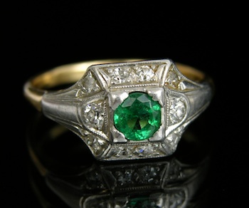 Appraisal: An Art Deco Emerald Ring in Platinum k yellow gold