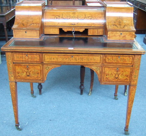 Appraisal: An Edwardian satinwood and marquetry inlaid writing desk of Carlton