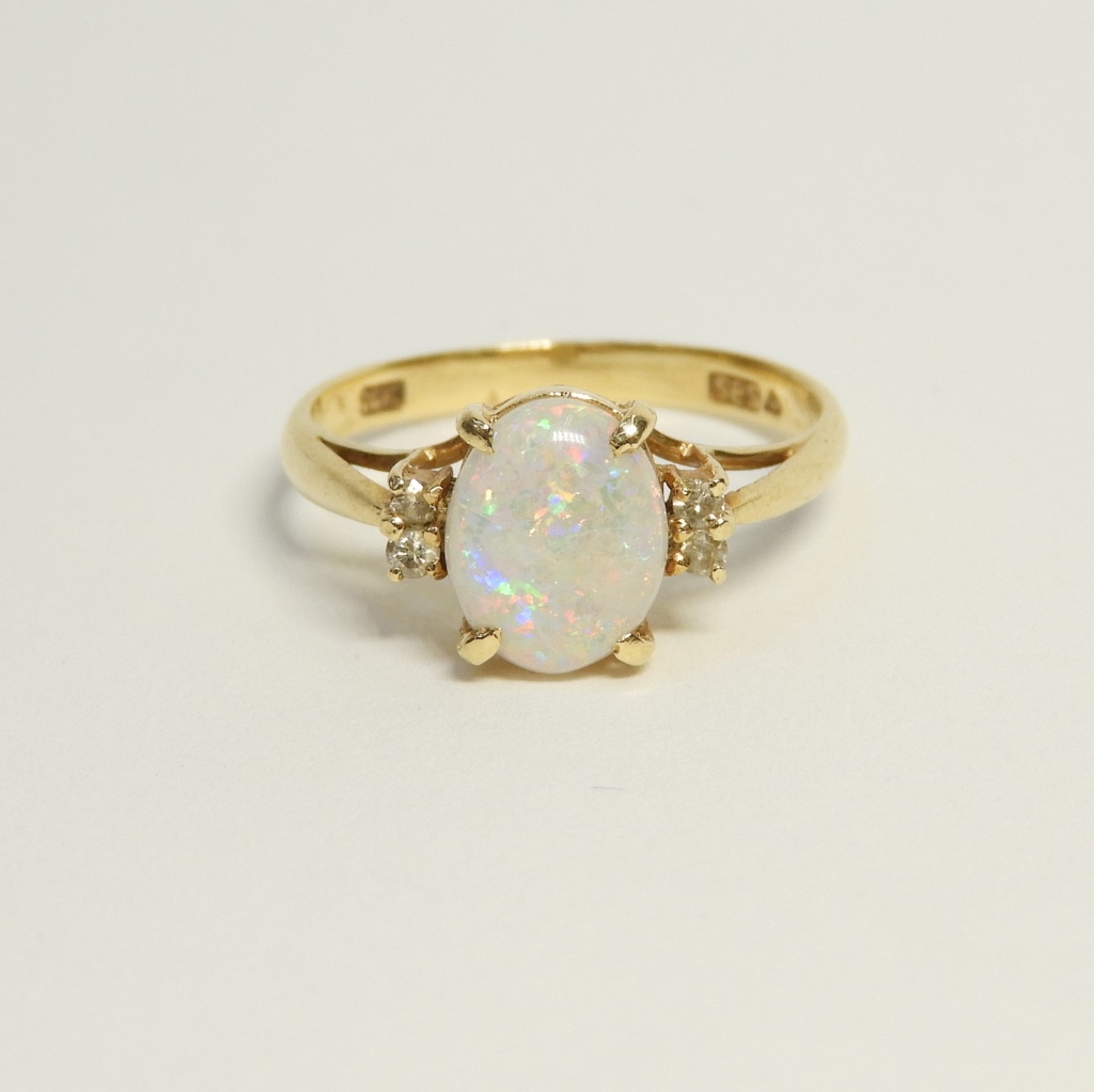 Appraisal: K GOLD OPAL CABOCHON DIAMOND RING Europe th CenturyCenter mounted