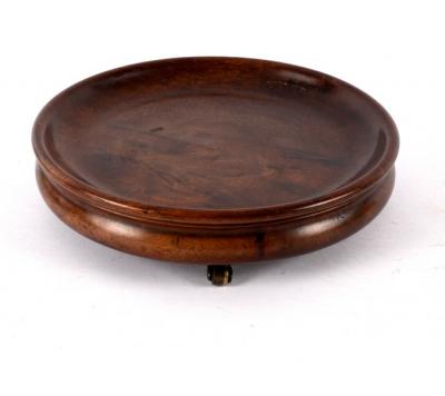 Appraisal: A Georgian circular mahogany coaster on three barrel feet cm