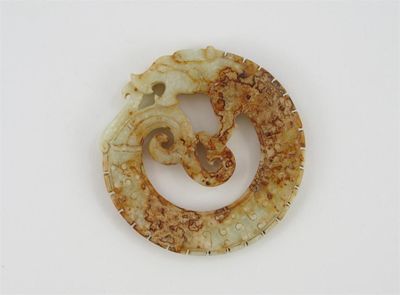 Appraisal: A calicified jade disc derived from a Neolithic pendant in