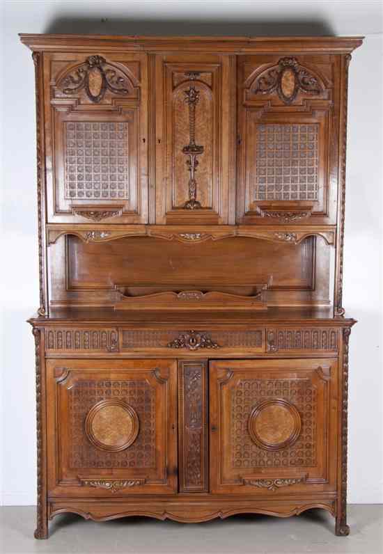 Appraisal: A Continental Walnut Sideboard the superstructure having a stepped molded