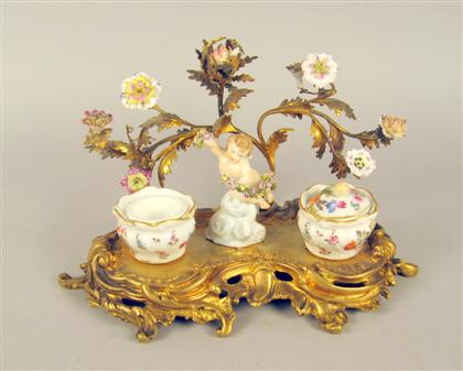 Appraisal: French porcelain gilt metal inkstand The gilt metal foliate scrolled