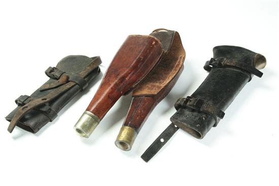 Appraisal: THREE SADDLE HOLSTERS American nd half- th century leather Includes