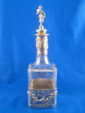 Appraisal: A silver mounted spirit decanter a broad band around the