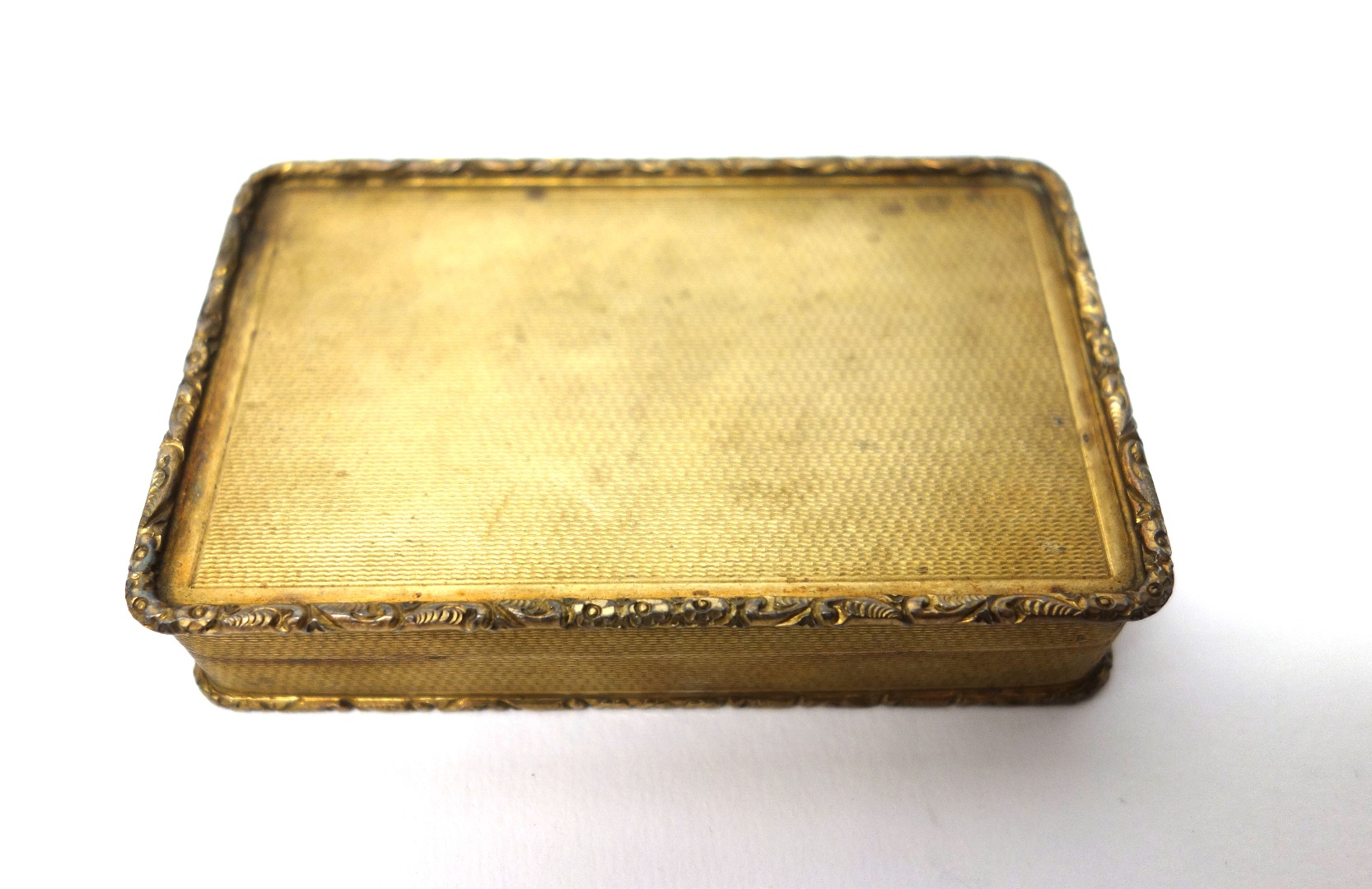 Appraisal: A silver gilt rectangular hinge lidded snuff box with engine