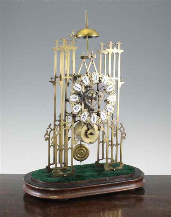 Appraisal: A Victorian single fusee brass skeleton clock with 'cathedral' facade