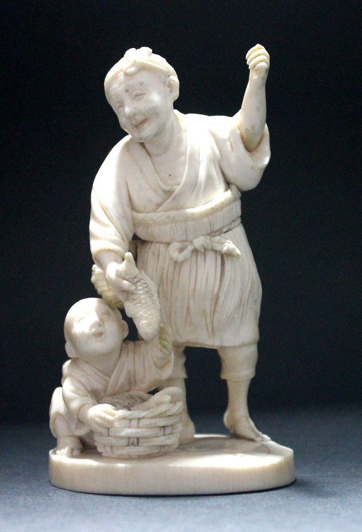 Appraisal: A Japanese ivory okimono of a an old man and