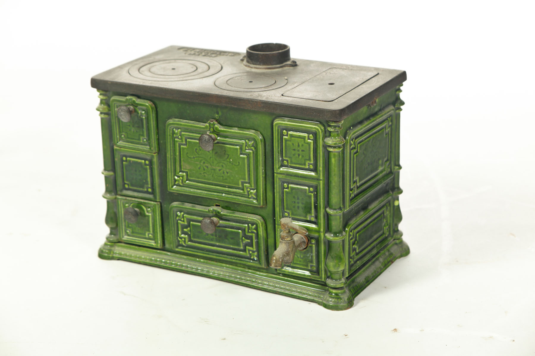 Appraisal: CAST IRON GREEN ENAMELED CHILD'S STOVE England st quarter- th