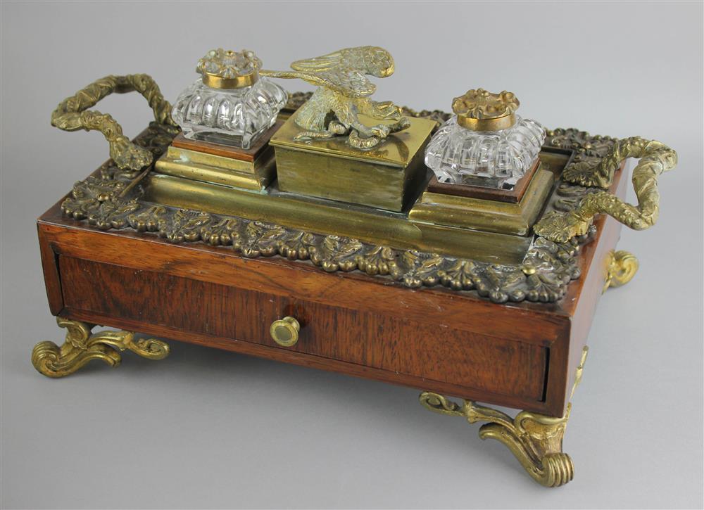 Appraisal: REGENCY BRASS-MOUNTED ROSEWOOD INKSTAND early th Century rectangular the top