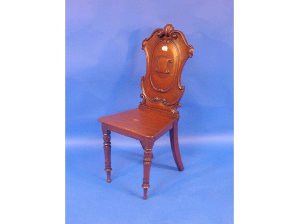 Appraisal: A Victorian oak hall chair with carved cartouche back