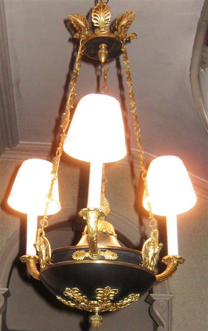 Appraisal: Empire style gilt and black patinated metal three light chandelier