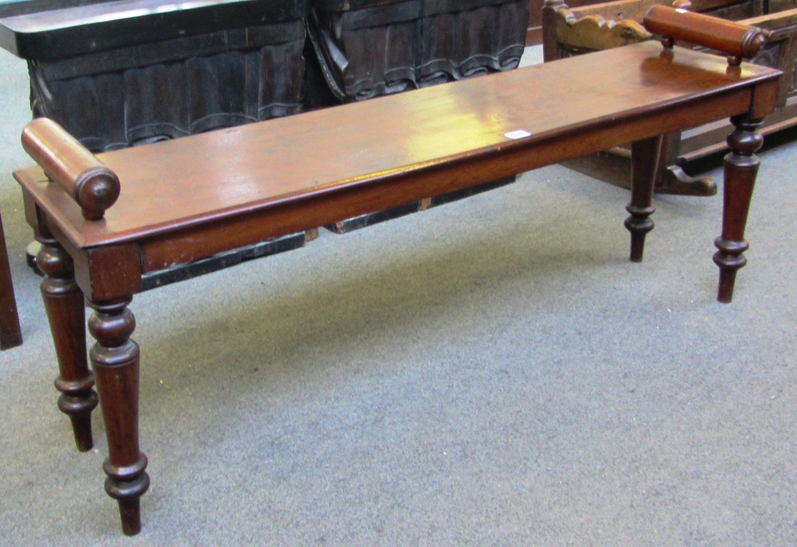 Appraisal: A th century mahogany hall bench on turned supports cm