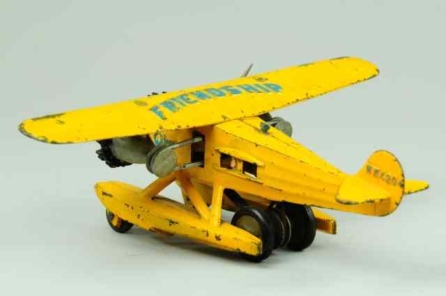 Appraisal: HUBLEY FRIENDSHIP AIRPLANE C cast iron painted in yellow overall