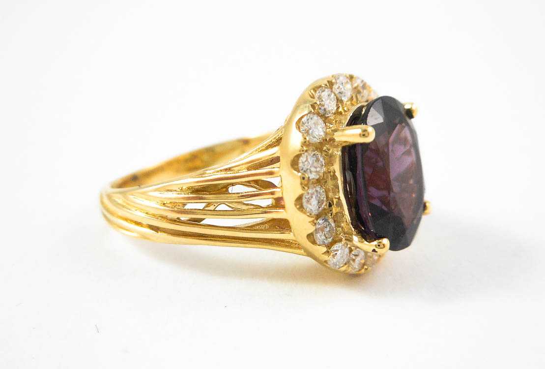 Appraisal: PURPLE SPINEL DIAMOND AND FOURTEEN KARAT GOLD RING with round-cut