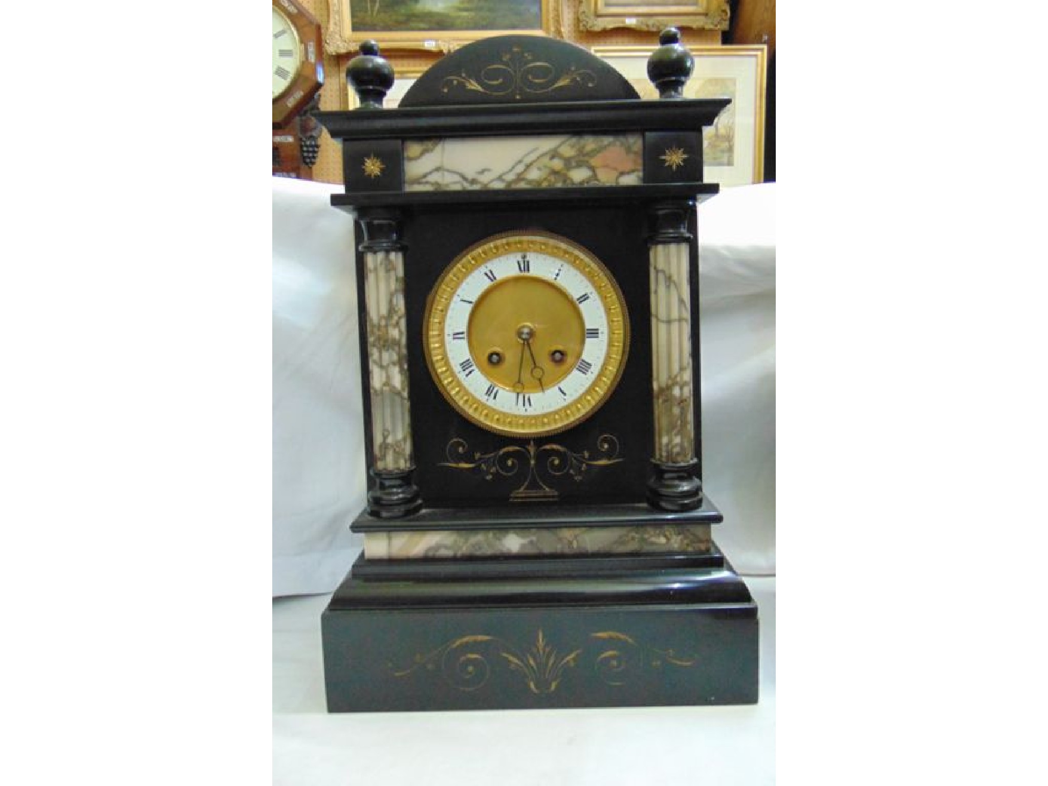 Appraisal: A Victorian black slate and polished marble mantle clock with