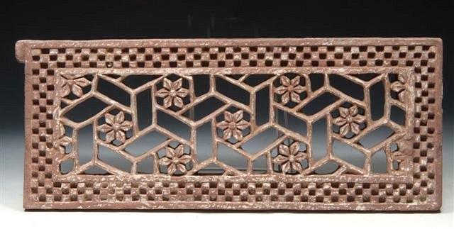 Appraisal: AN ANTIQUE INDIAN CARVED AND PIERCED STONE OPEN FRETWORK PANEL