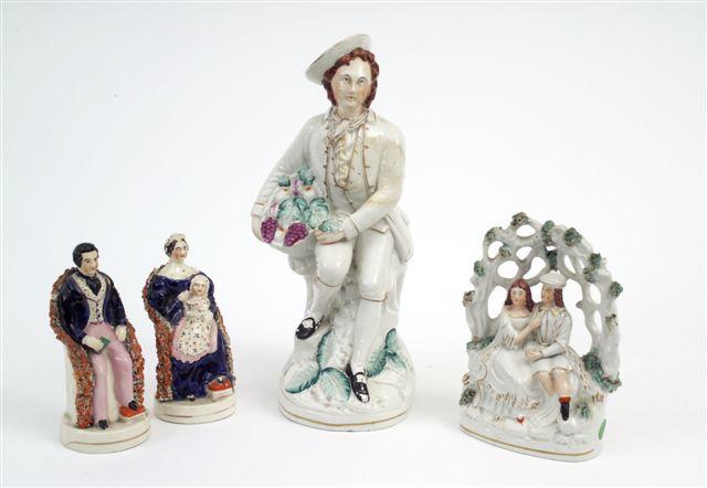 Appraisal: PAIR OF STAFFORDSHIRE BOCAGE FIGURES OF VICTORIA AND ALBERT th