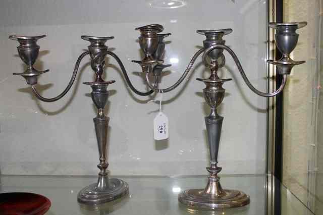 Appraisal: A PAIR OF SILVER PLATED TWO BRANCH CANDELABRA each on