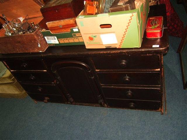 Appraisal: A Victorian pine brown painted dresser or shop's counter the