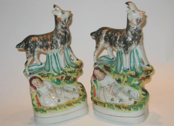 Appraisal: STAFFORDSHIRE ENGLAND Pair of porcelain figure groups each showing a