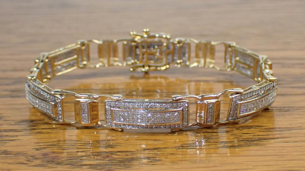 Appraisal: DIAMOND AND TWO-TONE GOLD BRACELET The - k yellow and