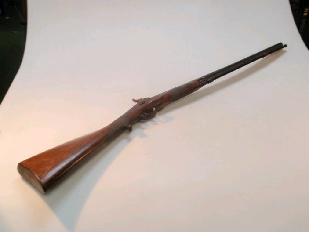 Appraisal: An antique black powder side lock percussion rifle