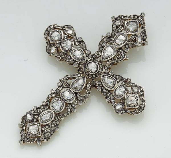 Appraisal: A diamond cruciform pendant mounted in silver-topped gold