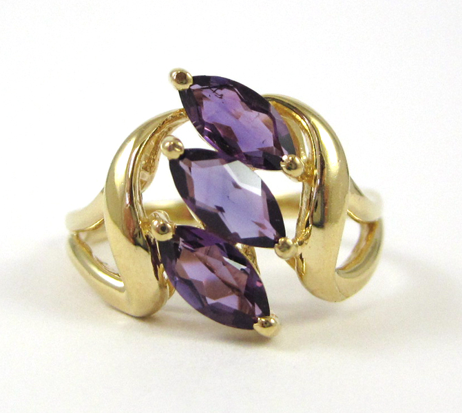 Appraisal: AMETHYST AND TEN KARAT YELLOW GOLD RING set with three