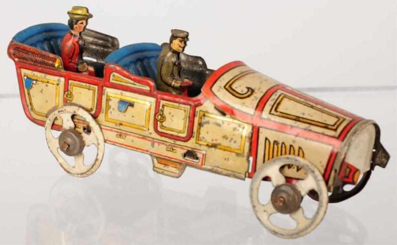 Appraisal: Tin Litho Limousine Automobile Penny Toy German Lithographed driver and