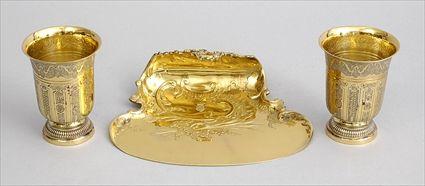 Appraisal: AUSTRIAN SILVER GILT CRUMBER AND TWO GOLD-PLATED CUPS The st