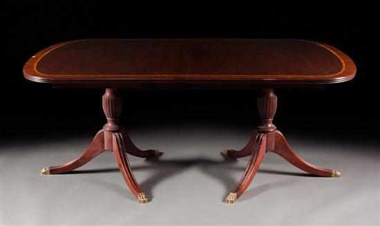 Appraisal: Henkel-Harris Federal style carved mahogany double pedestal dining table banded