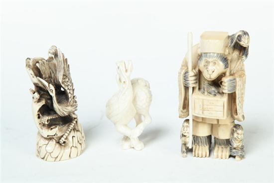 Appraisal: THREE IVORY ANIMALS Asian st half- th century Monkey entertainer