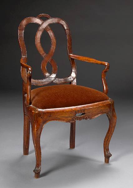 Appraisal: An Italian Rococo walnut armchair second half th century The