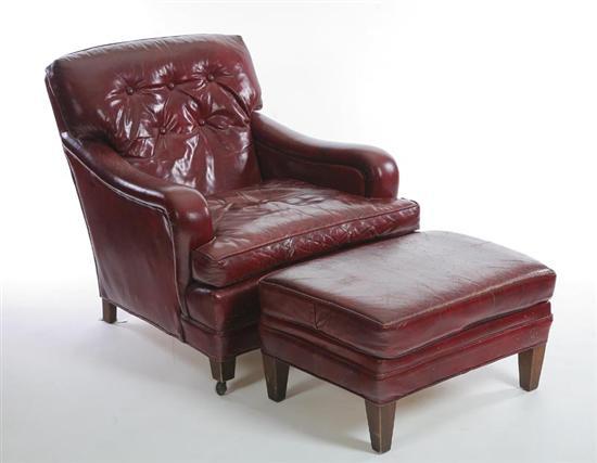 Appraisal: CLUB CHAIR AND OTTOMAN Maroon leather armchair and ottoman on