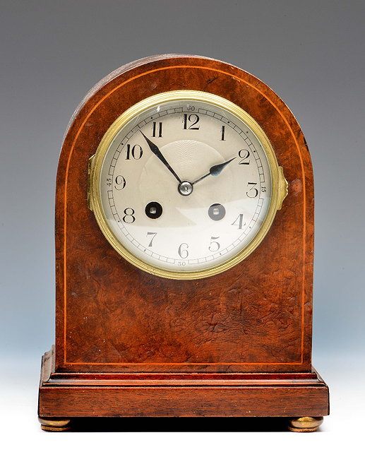 Appraisal: A burr walnut mantel clockthe convex silvered Arabic dial with