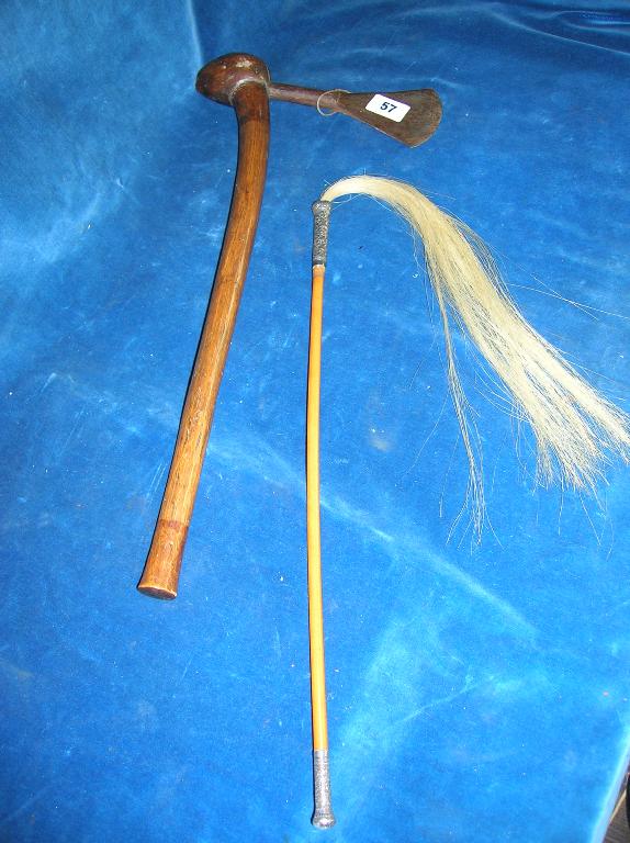 Appraisal: An African axe with wooden handle and native iron blade