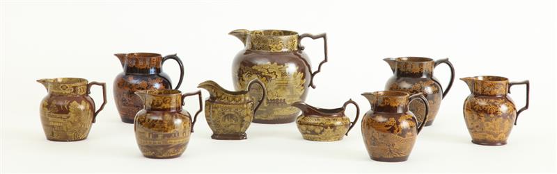 Appraisal: GROUP OF SEVEN STAFFORDSHIRE BROWN-GLAZED YELLOW TRANSFERWARE PITCHERS AND TWO