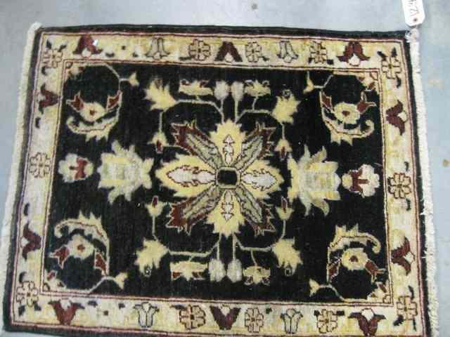 Appraisal: Oushak Persian Handmade Mat fine floral on indigo field ivory