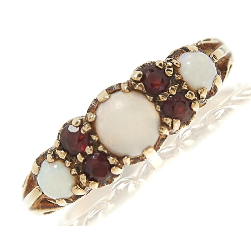 Appraisal: An opal and garnet ring in ct gold London g