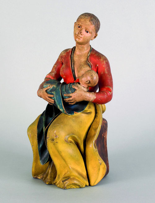 Appraisal: Carved and painted figure of a woman nursing a child