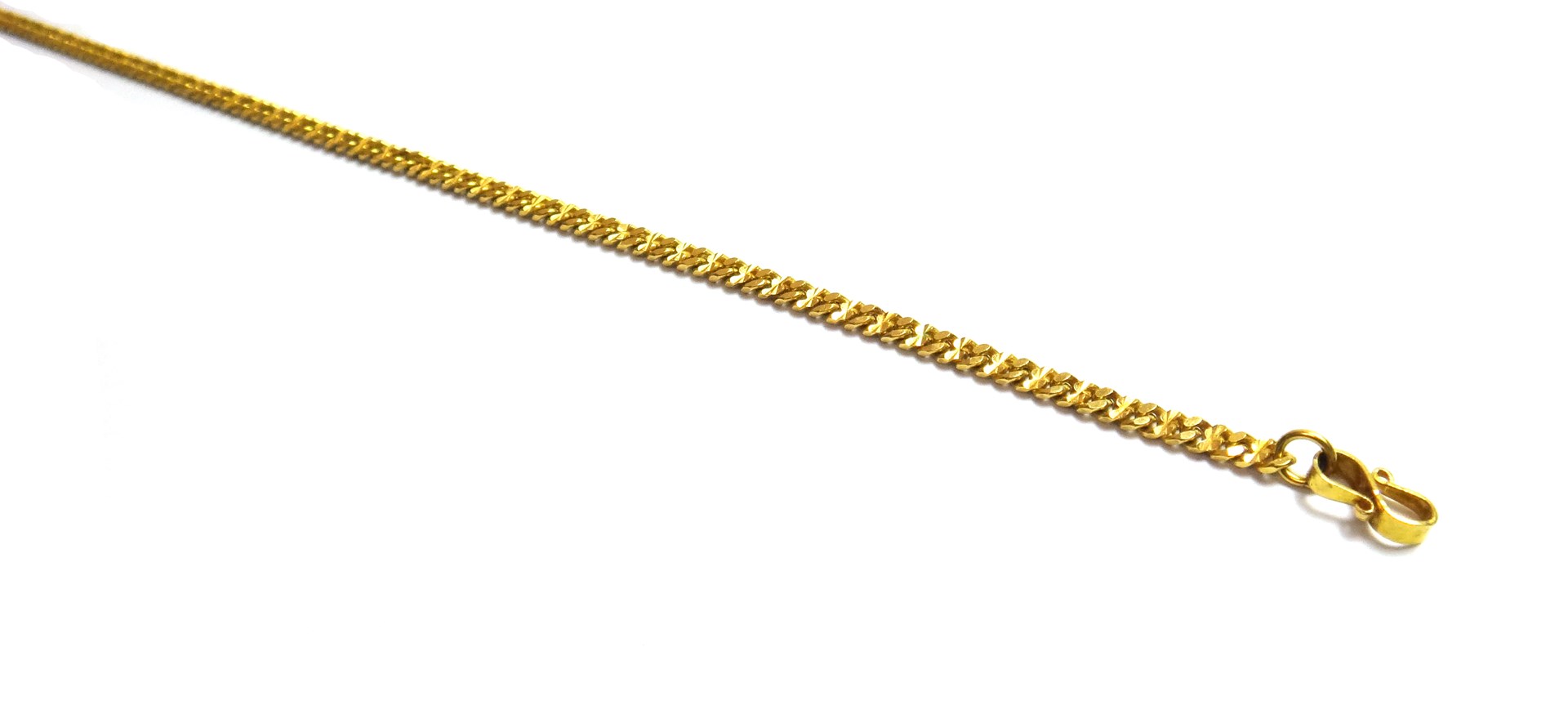 Appraisal: An Eastern gold neckchain in a faceted curb link design