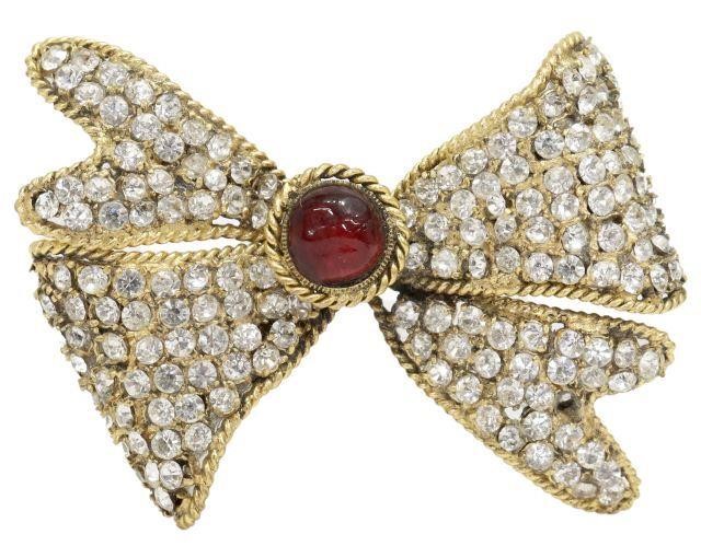 Appraisal: Vintage Chanel gold-tone metal bow brooch center red gripoix cabochon