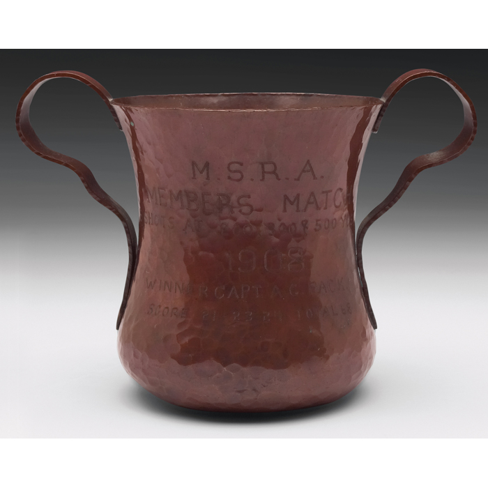 Appraisal: Arts and Crafts hammeredcopper vase double handled form withapplied medallion